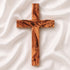 Handmade olive wood Thorn cross from Bethlehem on white surface