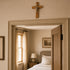 Small thorn crucufix on a wall above a door