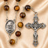 A St. Charbel rosary featuring polished brown tiger's eye beads, a silver St.