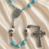 Turquoise beaded rosary with Celtic-style crucifix and ceramic Our Father bead accents
