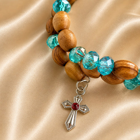 Olive wood bead bracelet with turquoise faceted beads and red-stone cross pendant