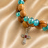 Olive wood bead bracelet with turquoise faceted beads and red-stone cross pendant
