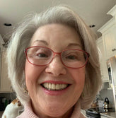 Happy elder woman with glasses