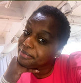 African woman in red t-shirt