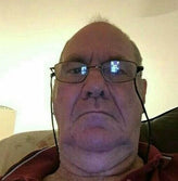 Older caucasian man with glasses.