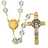 White glass beads St. Benedict rosary with gold chain and crucifix on a white background.