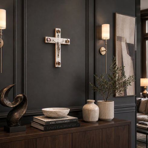Decorative elements including a cross, sculpture, books, and plants in a room setting.
