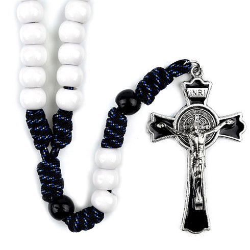 Rosary with white beads, blue and black beaded strands, and a silver cross on a white background.