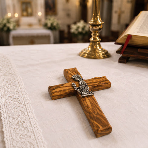Olive wood communion cross laid on an altar in a church