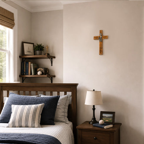 Olive wood communion cross for boys on a wall in bedrom