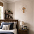 Olive wood communion cross for boys on a wall in bedrom