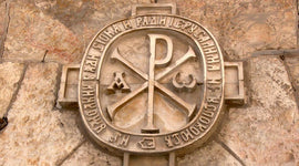 Chi Rho symbol engraved in stone wall