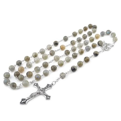Handmade Labradorite rosary featuring Holy Family medal and silver plated crucifix, against white surface.