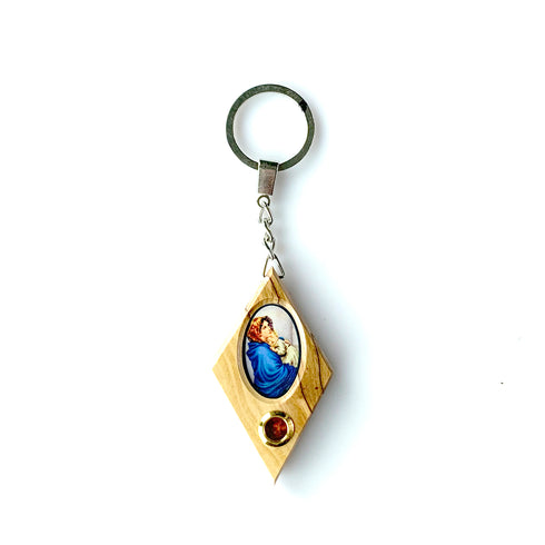 Olive wood keychain featuring a printed image of the Mary with Baby Jesus and a capsule of Holy Soil from the Holy Land, set against a white background.