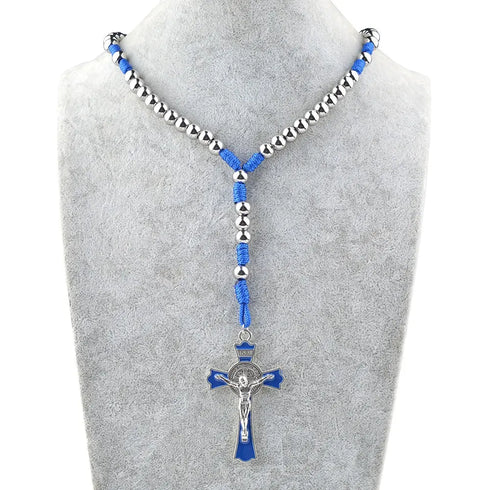 Saint Benedict stainless steel crucifix rosary with blue cording and silver beads on white background.