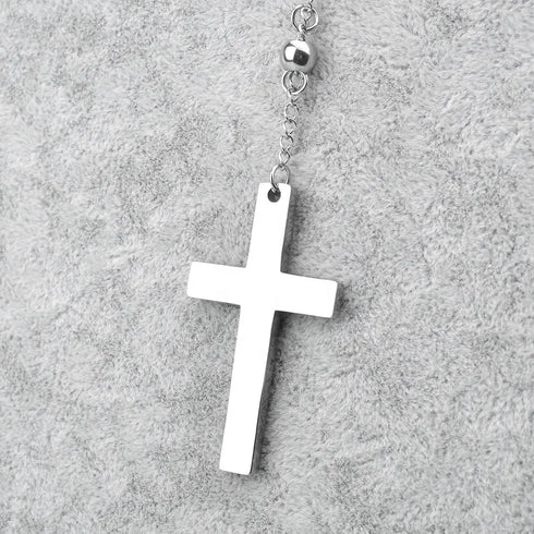 Silver Saint Benedict rosary with 4mm stainless steel beads and crucifix, laid on grey background. 