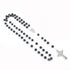 Black lava stone rosary with silver Celtic cross and Miraculous medal on a white background.