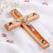 A hand-crafted wooden Latin crucifix with Four Elements, mounted on a white fabric.