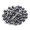 Black hematite rosary with Holy Soil centrepiece and a crucifix on a white background.