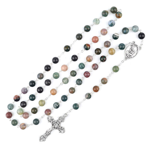 Multicoloured beaded stone rosary with a silver cross on a white background