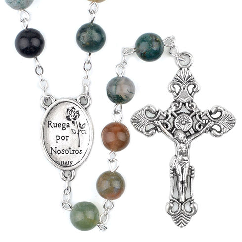 Rosary with colourful stone beads and silver crucifix on a white background