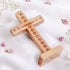 Back of standing latin cross with "Jerusalem" and Stations of Cross engraved, on white background.