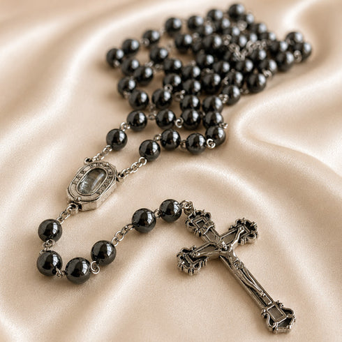 Hematite bead rosary with oval Our Lady of Lourdes medal and metal crucifix centerpiece