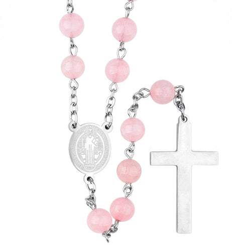 Pink bead rosary with silver cross on a white background