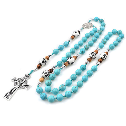 Turquoise beaded necklace with celtic cross pendant on a white background