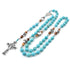 Turquoise beaded necklace with celtic cross pendant on a white background